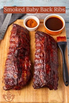 barbecue ribs on a cutting board with sauces