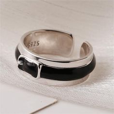 This Silver Fashion Belt Buckle features an oil drop plain ring design. This buckle is expertly crafted with a polished silver finish for a timeless look. The elegant design is sure to add a touch of sophistication to any outfit. Product Details Material: 925 Silver Color: White Gold Plated Size: US Size #8 Adjustable Weight: about 6.7g SKU: AR23101910 Product Keywords: Distorted band rings, Avante-garde rings, Unique shaped rings, vintage rings, vintage band rings, gold band ring, vintage rings Classic Adjustable Jewelry With Silver Buckle, Elegant Silver Enamel Ring, Elegant Silver Enamel Open Ring, Elegant Silver Open Enamel Ring, Elegant Silver Enamel Ring In Sterling Silver, Elegant Silver Enamel Ring For Formal Occasions, Elegant Silver Enamel Ring For Formal Events, Classic Silver Enamel Ring For Formal Occasions, Elegant Silver Enamel Ring With Black Details