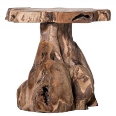 a table made out of tree trunks on a white background