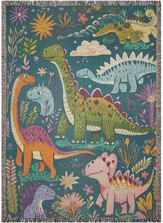 a blanket with dinosaurs and plants on it