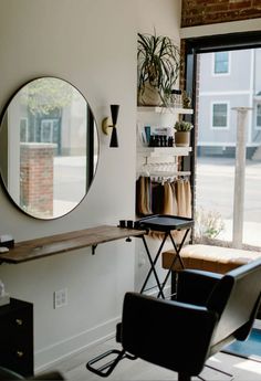 a chair and mirror in a room