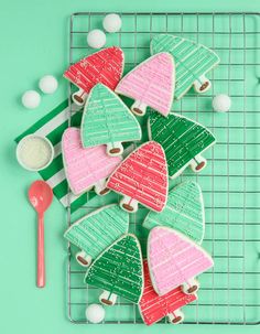 a green cutting board topped with lots of hearts