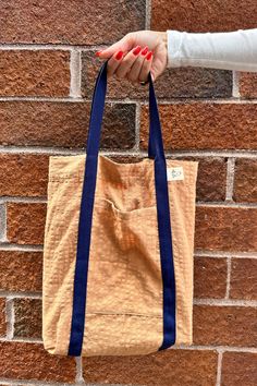 100% cotton Book Tote: 13.5"W x 11.5"H 14" Handles phone pocket made in NYC The cutest Totebag in town, ideal for everyday use. Cotton Canvas Bag With Silt Pocket For Everyday, Brown Reusable Everyday Bag, Brown Reusable Bag, Brown Everyday Reusable Bag, Everyday Brown Reusable Bag, Reversible Cotton Bags For Everyday Use, Everyday Reversible Cotton Bags, Reversible Cotton Shoulder Bag For Everyday, Cream Cotton Bags With Pockets