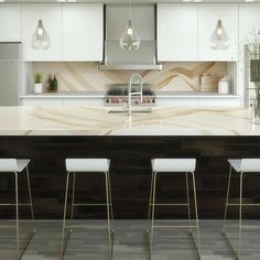 a kitchen with marble counter tops and bar stools