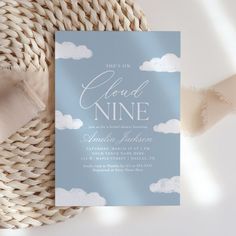 a blue and white wedding card with clouds on it