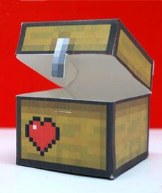 an origami box with a heart on it