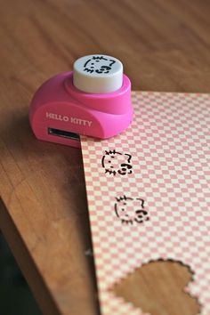 a hello kitty stamper sitting on top of a piece of paper