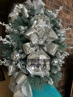 a christmas wreath on top of a blue box