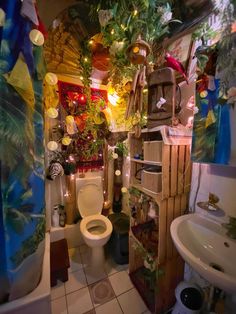 the bathroom is decorated with plants and decorations