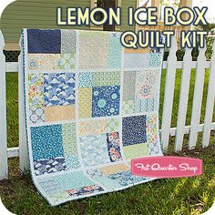 the lemon ice box quilt kit is on display in front of a white picket fence