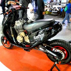 a black motorcycle on display at a show