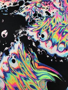 an abstract painting with lots of colors and bubbles in the water on top of it