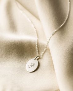 Florence is one of our largest personalized pendants - 12x18mm and ready to inscribe with your favorite initial or illustrated design. Dainty Oval Charm Necklaces, Dainty Oval Charms Necklaces, Dainty Oval Necklaces With Charms, Classic White Gold Charm Necklace With Initials, Minimalist Oval Pendant Charm Necklace For Anniversary, Minimalist Personalized Charm Necklace With Oval Pendant, Minimalist Personalized Oval Pendant Charm Necklace, Classic Oval Pendant Charm Necklace, Oval Charm Necklaces As Gift