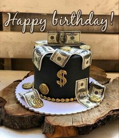 a birthday cake with money on top