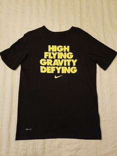 Nike The Tee Black High Flying Gravity Defying Short Sleeve T-Shirt Boys  Size XL Excellent Condition, lightly worn! SEE PICS!! Nike T-shirt With Text Print And Crew Neck, Nike Graphic Tee With Letter Print, Nike Crew Neck T-shirt With Letter Print, Nike Letter Print Crew Neck T-shirt, Nike Graphic Tee With Text Print, Nike Black T-shirt With Letter Print, Black Nike T-shirt With Letter Print, Nike Text Print T-shirt For Streetwear, Nike Short Sleeve T-shirt With Screen Print