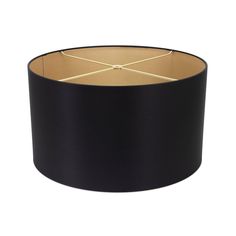 a black lampshade with gold trim on the top and bottom, against a white background