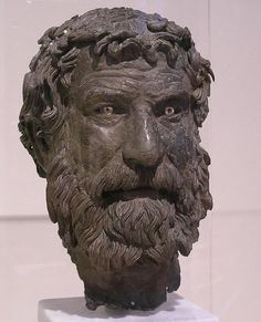 a statue of a man's head with beard and moustache