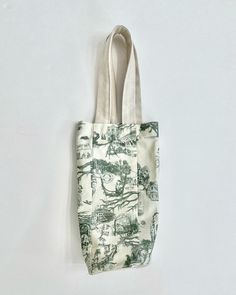 Savannah Toile Wine Carrying Tote - Blue, green, red These bags are designed and handmade in our boutique-located in Savannah, GA. Handmade Green Canvas Bag For Daily Use, Green Handmade Canvas Bag For Daily Use, Handmade Green Canvas Travel Bag, Green Handmade Canvas Travel Bag, Savannah Ga, Savannah, Savannah Chat, Carry On, Blue Green