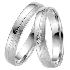 two white gold wedding rings with diamonds