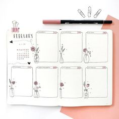 an open planner with flowers in vases on it