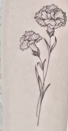 a small flower tattoo on the right side of the leg, with two flowers in it