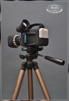 a camera is sitting on top of a tripod