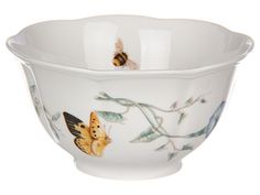 a white bowl with two butterflies on it