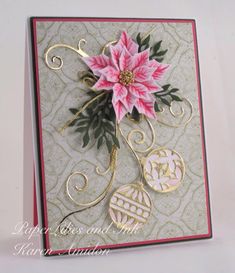 a close up of a card with a flower on the front and an ornament on the back