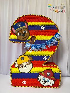 a cake shaped like the number two for a paw patrol birthday