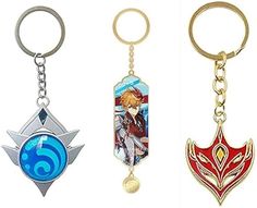 three different key chains with anime characters on them, one is red and the other is blue