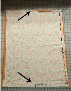 the fabric has been cut into two sections and is being used to make a quilt