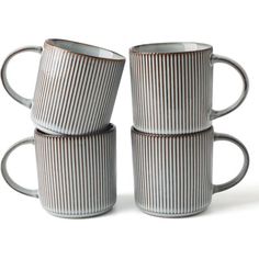 four coffee mugs stacked on top of each other in the shape of three lines