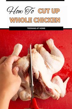 someone cutting up chicken with a pair of scissors on a red surface and text overlay that reads how to cut up whole chicken