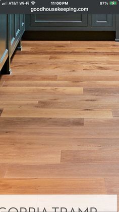 an image of a kitchen floor with wood floors and cabinets in the background that says, goodhouse keeping com