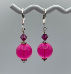 Handmade Dangle Earrings made from vintage lucite beads in bright pink topped off with bright pink crystals.  Accented with sterling silver rondelles. They dangle to 1 inch long and have a nickel free lever back. Adds a playful pop of color to your outfit! Fun Pink Dangle Jewelry, Pink Dangle Earrings With Large Beads, Pink Metal Dangle Beaded Earrings, Pink Nickel-free Dangle Beaded Earrings, Artistic Pink Dangle Earrings, Earrings Handmade Dangle, Vintage Lucite, Pink Crystal, Pink Tops