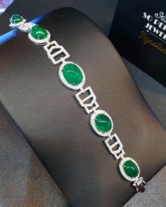 "A DREAM COMES TRUE! Gorgeous masterpiece! ONE OF A KIND Bracelet! Featuring 7 pieces of extra fine GLOWING VIVID GREEN Zambian Emerald weighting a total of 58.94 carats... and 334 pieces of SUPER SPARKLING, top-grade, F/VS Diamonds (4.01 carat in total). SET IN ONE-OF-A-KIND 18K Solid White Gold, meticulously designed and handcrafted BRACELET! A true heirloom piece that can transcend beyond times and eras.... JUST FINISHED, HANDMADE BY OUR GOLDSMITHS! DAZZLING GENUINE EMERALDS! Extremely rare, Luxury Silver Bracelets With Cabochon, White Gold Emerald Bracelet, Luxury Round Emerald Bracelets, White Gold Emerald Bracelets, Round White Gold Bracelets With Emeralds, Wooden Bracelet, Unusual Jewelry, Handcrafted Bracelets, Vs Diamond