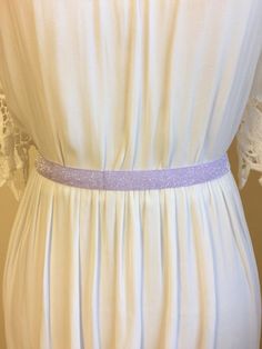 "Perfectly charming for you or your bridal party. This sparkly pink elastic belt adds just enough pizazz to brighten up your day. It'll also be super comfortable all day long, from the sun drenched ceremony, to the after-hours dance party!  Each belt measures 5/8\" in width. Mannequin has a 27\" waist. Hook closure at back  Please let me know when you order your 'Size' (waist measurement) and I will make a custom sized belt with just enough stretch for you. These are so cute on tunics, tanks, an Spring Party Fitted Sashes, Fitted Sashes For Spring Party, Fitted Fabric Party Belt, Adjustable Sashes Bridal Belt For Party, Adjustable Bridal Belt With Sashes For Party, Spring Party Fabric Belt, Adjustable Belts For Summer Parties, Mardi Gras Beads, Beautiful Belts