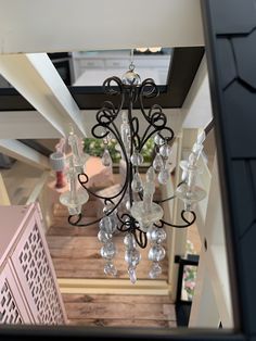 a chandelier hanging from the ceiling in a house