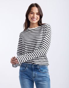 DESCRIPTION Embrace casual comfort with the Long Weekend Top in White/Black Stripe by White & Co. This top is designed for comfort and style, featuring a relaxed fit, crew neckline, and long sleeves. The crisp white base with black stripes brings a classic look perfect for casual days. This top ensures all-day comfort, making it an ideal choice for weekend wear or a relaxed day out. Team the Long Weekend Top with rolled-up jeans and white sneakers for a casual yet chic look. This versatile top s Casual Crew Neck Long Sleeve Top, Casual Long Sleeve Crew Neck Top, Black Long Sleeve Crew Neck Top For Spring, Black Relaxed Fit Long Sleeve Casual Top, Black Casual Long Sleeve Top With Relaxed Fit, Spring Black Long Sleeve Top With Relaxed Fit, Black Relaxed Fit Long Sleeve Top For Spring, Classic White T-shirt With Contrast Stripes, White Vertical Stripes Crew Neck T-shirt