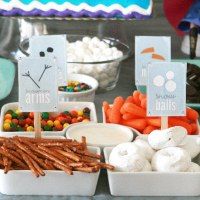 a table topped with lots of food and desserts