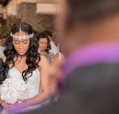 a bride and groom walking down the aisle