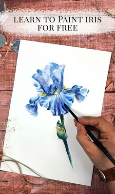 a person is painting a blue flower with watercolors on paper and the words learn to paint iris for free