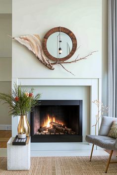 a living room with a fire place and a mirror on the wall over the fireplace