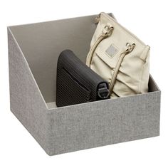 a purse and wallet in a box on a white background