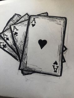 three playing cards with the ace symbol drawn on them