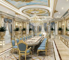 a large dining room with blue chairs and chandelier in the middle of it