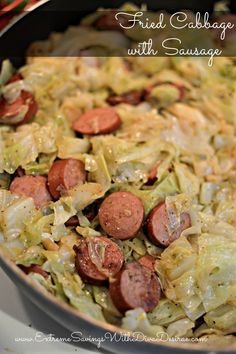 a skillet filled with cabbage and sausage