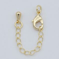 a gold plated chain with a clasp on the end and a hook in the middle