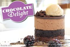 a chocolate cake with ice cream and berries on the side is featured in this advertisement