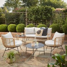 an outdoor seating area with chairs and tables